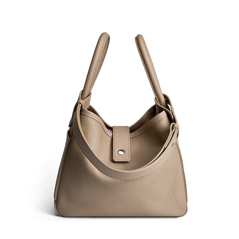 Dual Handle Lychee Leather Handbag in neutral tone with sleek design and dual carrying option.
