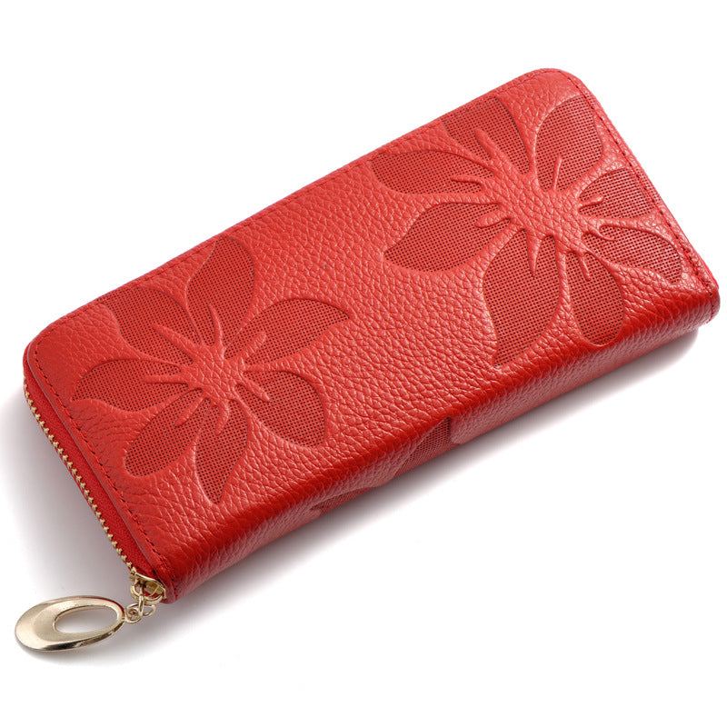Ladies leather floral wallet with embossed design in vibrant red, featuring a compact zipper closure for organizing essentials.