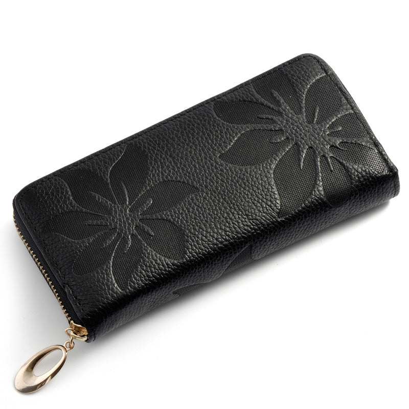 Ladies leather floral wallet with embossed flower design, sleek black color.