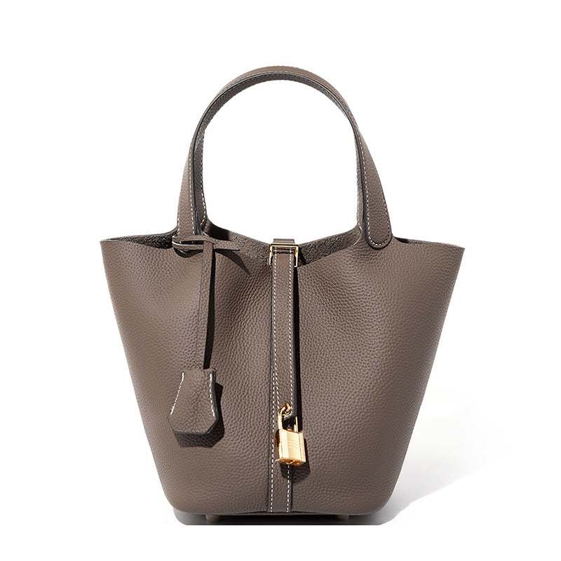 Lychee Leather Basket Tote in durable genuine leather with modern silhouette and removable interior bag.