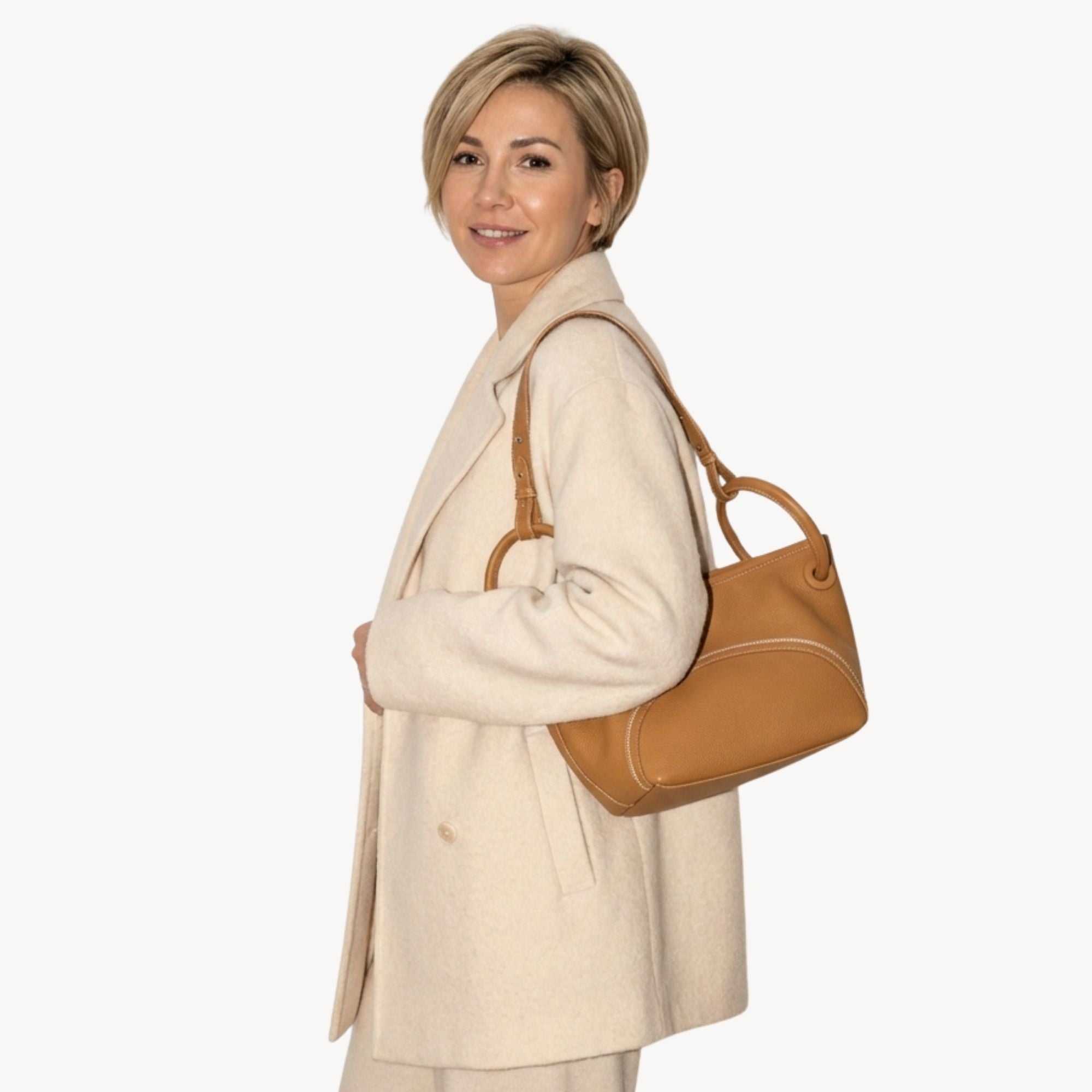 Full-grain leather crossbody bucket tote with circular handles and removable pouch