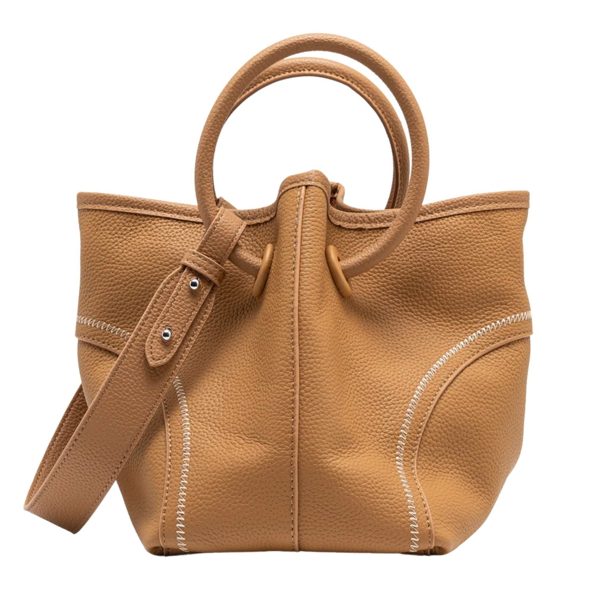 Leather crossbody bucket tote in full-grain lychee leather with circular handles and removable interior pouch