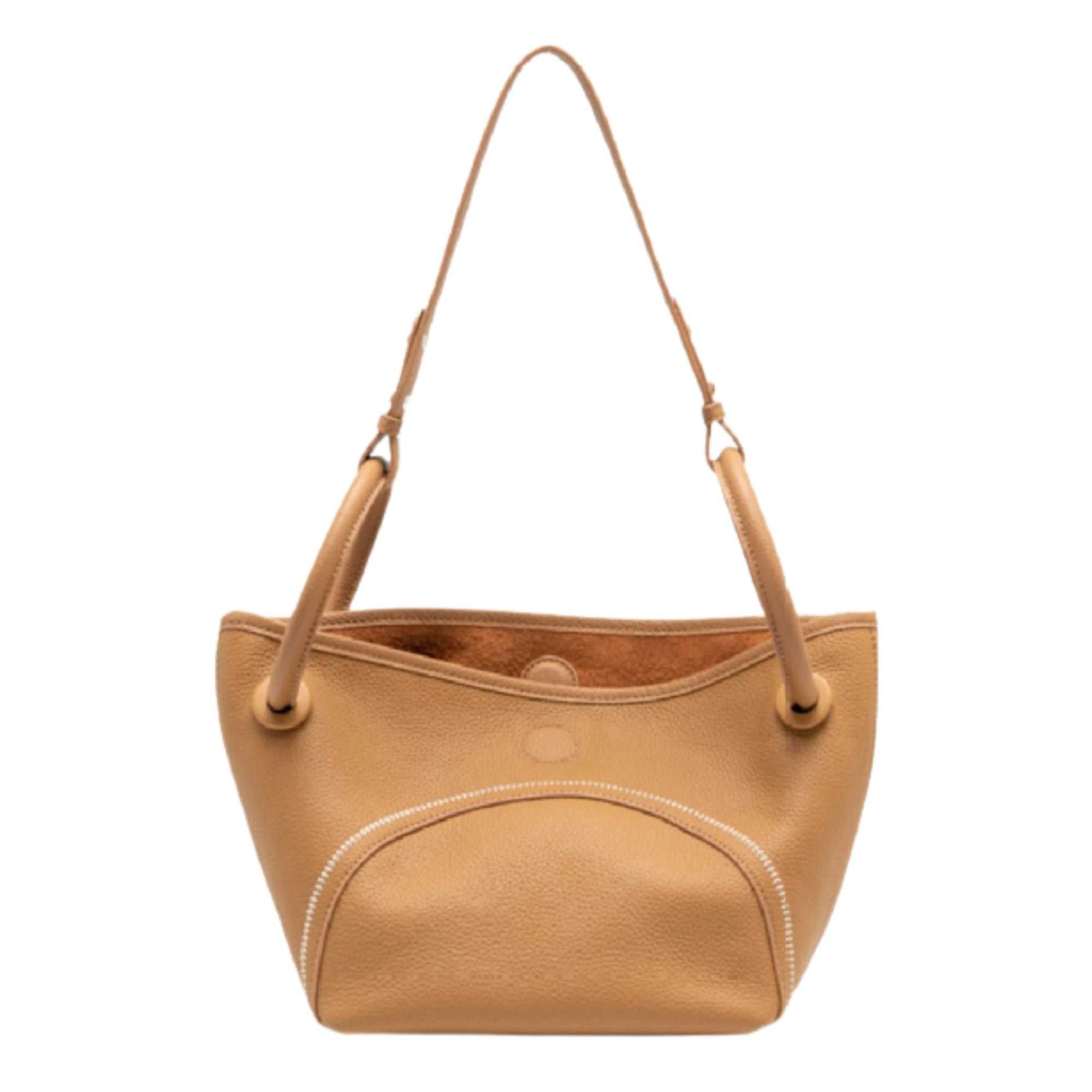 Mercer leather crossbody bucket tote with circular handles and removable pouch