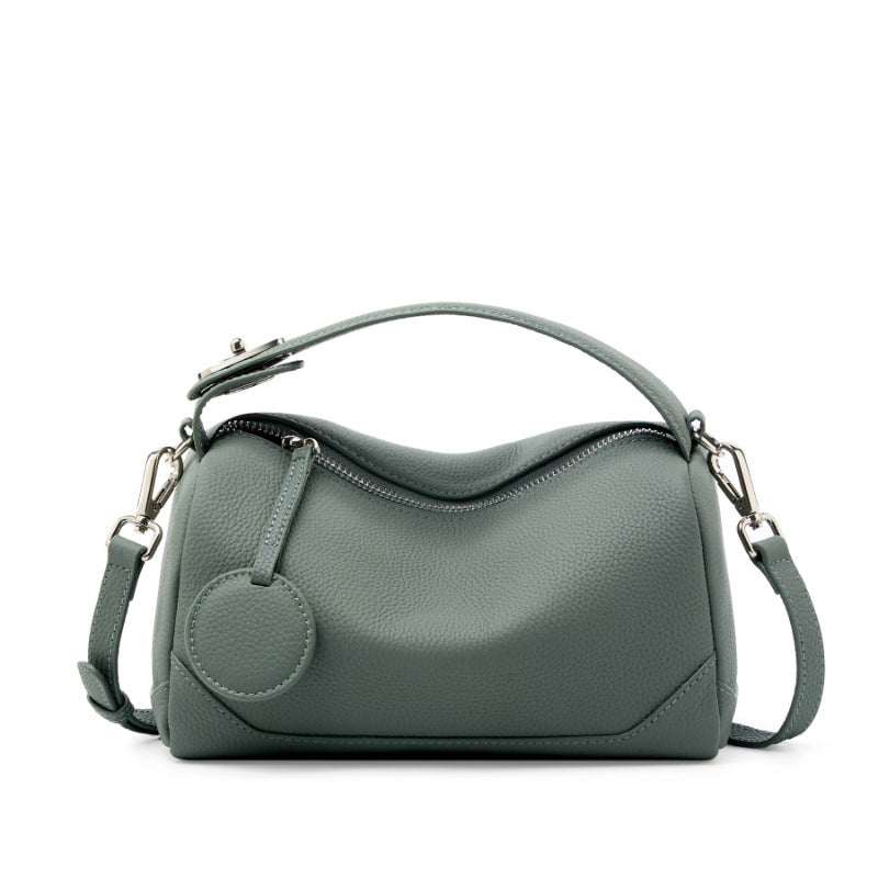 Petite modern lychee leather handbag in gray, featuring