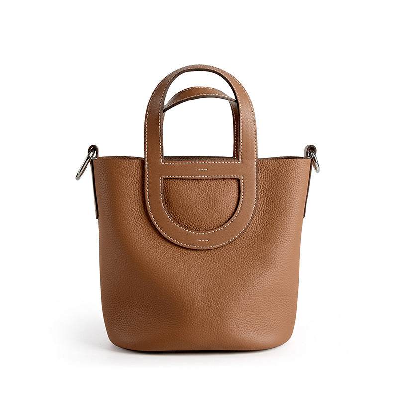 Sleek Leather Bucket Handbag in brown with lychee-pattern design, genuine leather, and removable interior bag.