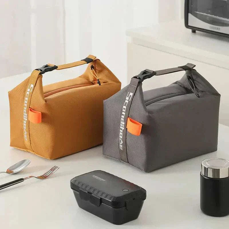 Adult lunch tote bags in orange and gray with lunch accessories.