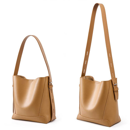 Bucket Tote Purse in genuine leather with single-shoulder strap, roomy interior, and reinforced stitching.