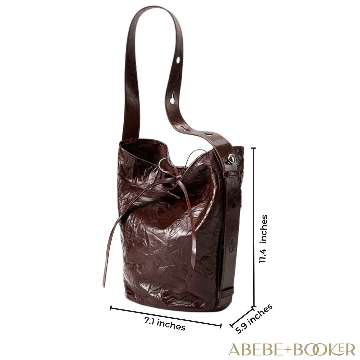 Burgundy Bucket Bag with wrinkled leather pattern and tie closure, shown with dimensions 11.4” high x 7.1” long x 5.9” wide.