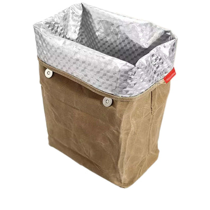 Waxed canvas lunch bag with insulated interior, designed for style and function.