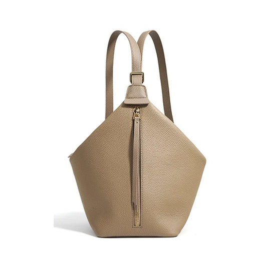 Beige convertible leather backpack purse with zipper detail and adjustable straps.