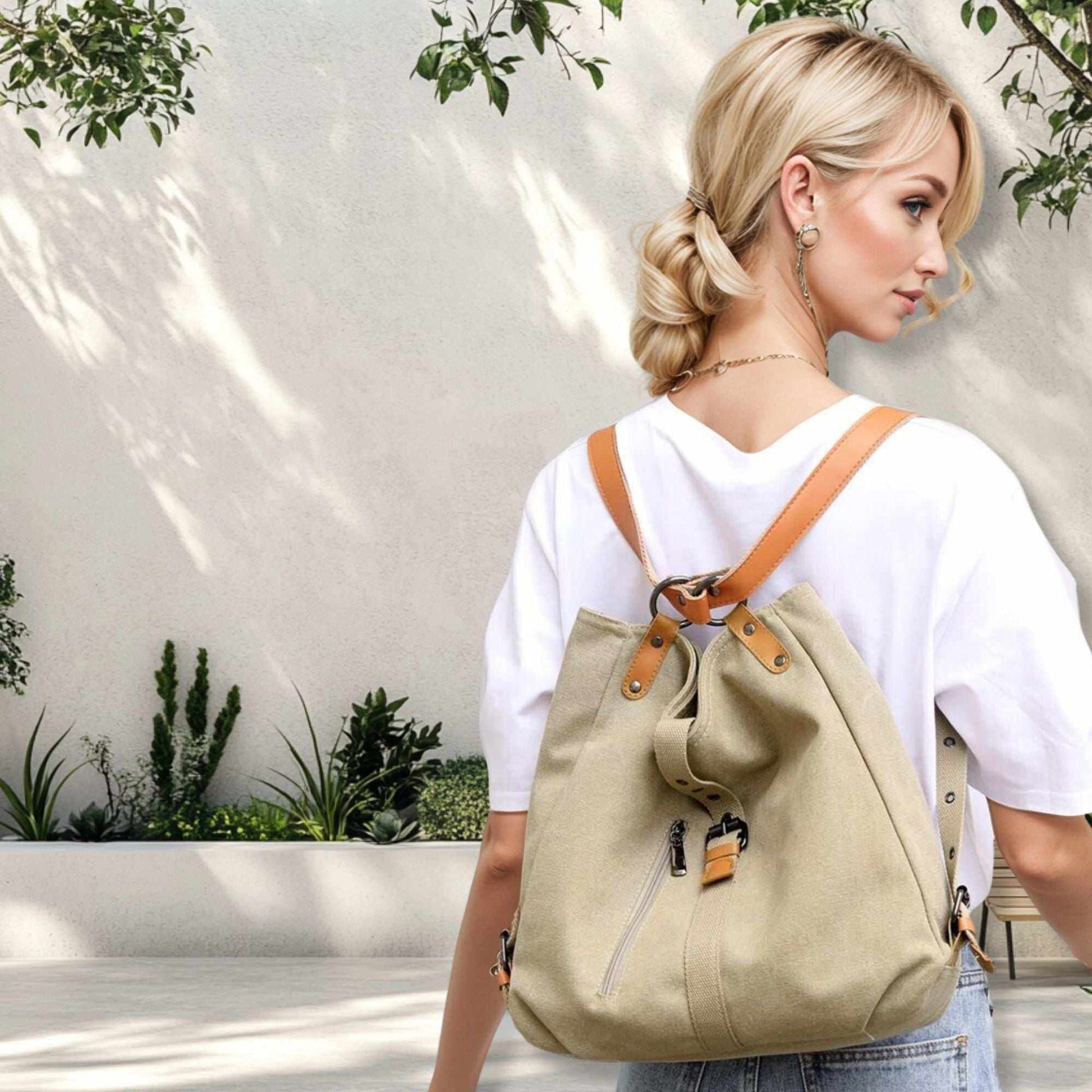 Woman wearing a convertible backpack purse handbag with vegan leather accents, showcasing its versatile design.