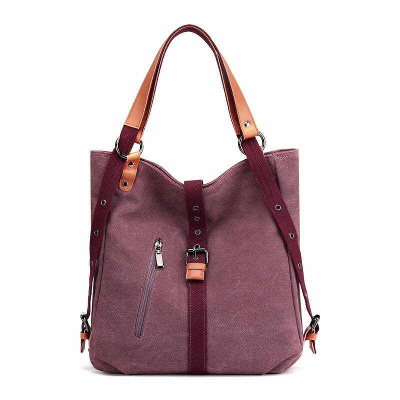 Convertible Canvas Backpack with vegan leather accents, adjustable shoulder strap, and secure buckle closure.