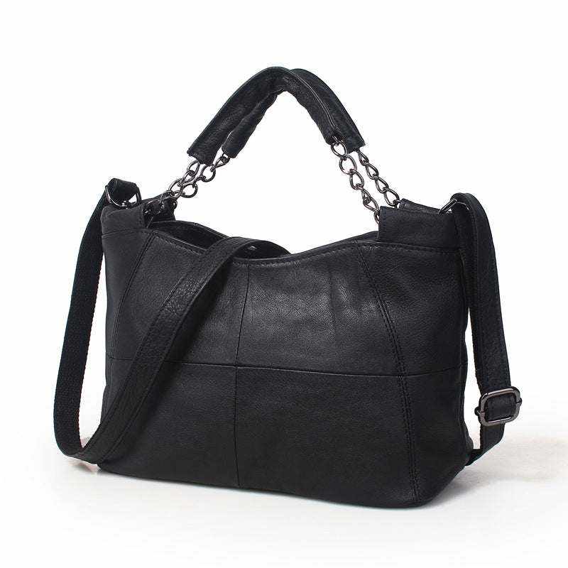 Cross Body Soft Leather Bag in black with chain-link handle and adjustable crossbody strap, elegant and stylish for versatile use.