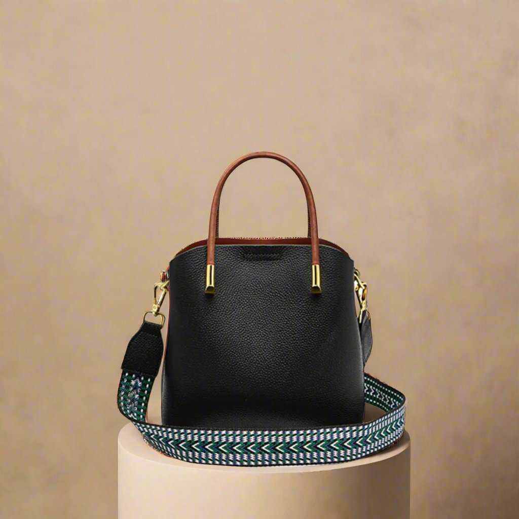 Crossbody Bucket Handbag in black leather with interchangeable strap.