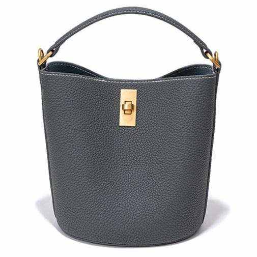 Genuine leather crossbody bucket purse with gold clasp in pewter gray color.