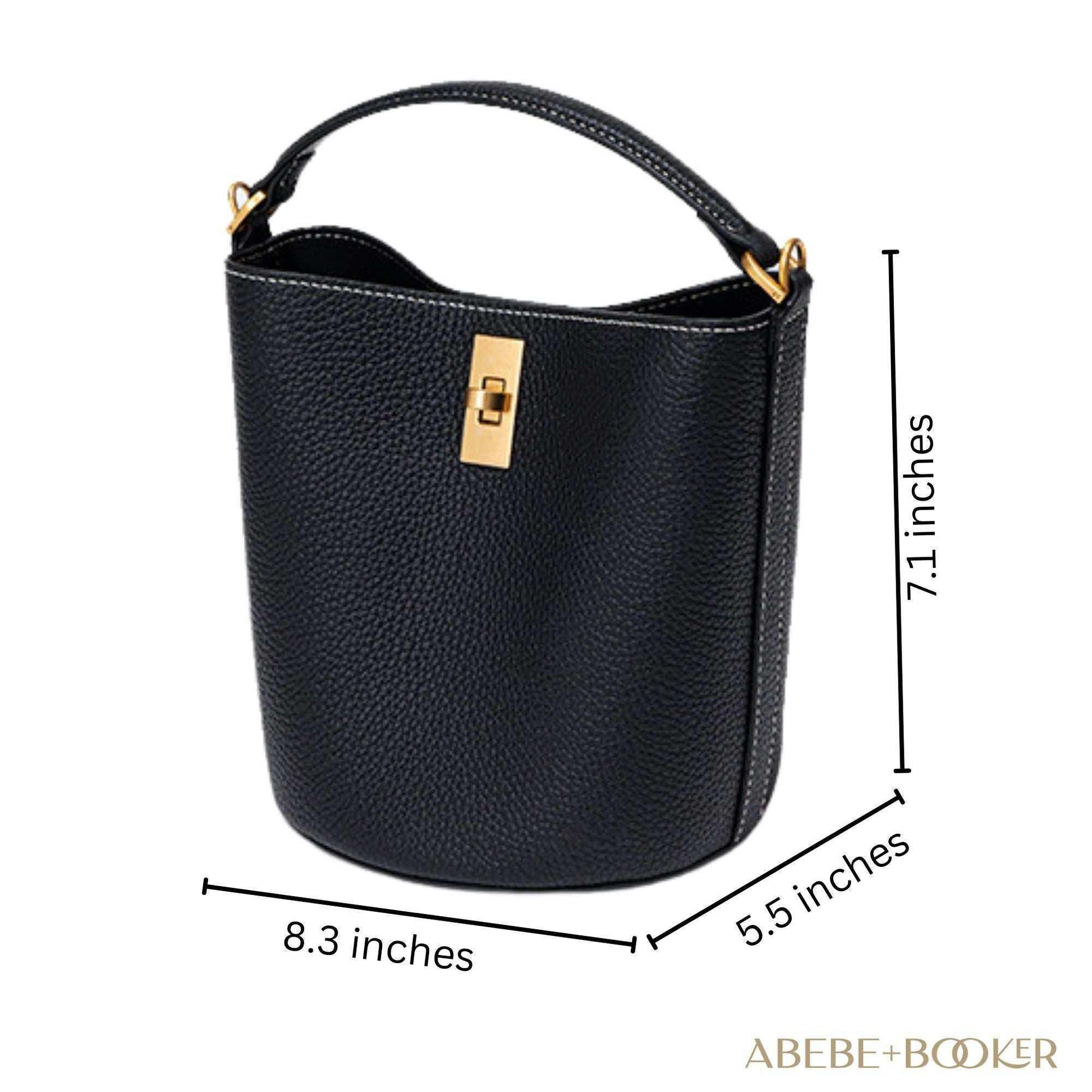 Black crossbody bucket purse with gold clasp, 8.3 x 7.1 x 5.5 inches, genuine leather.