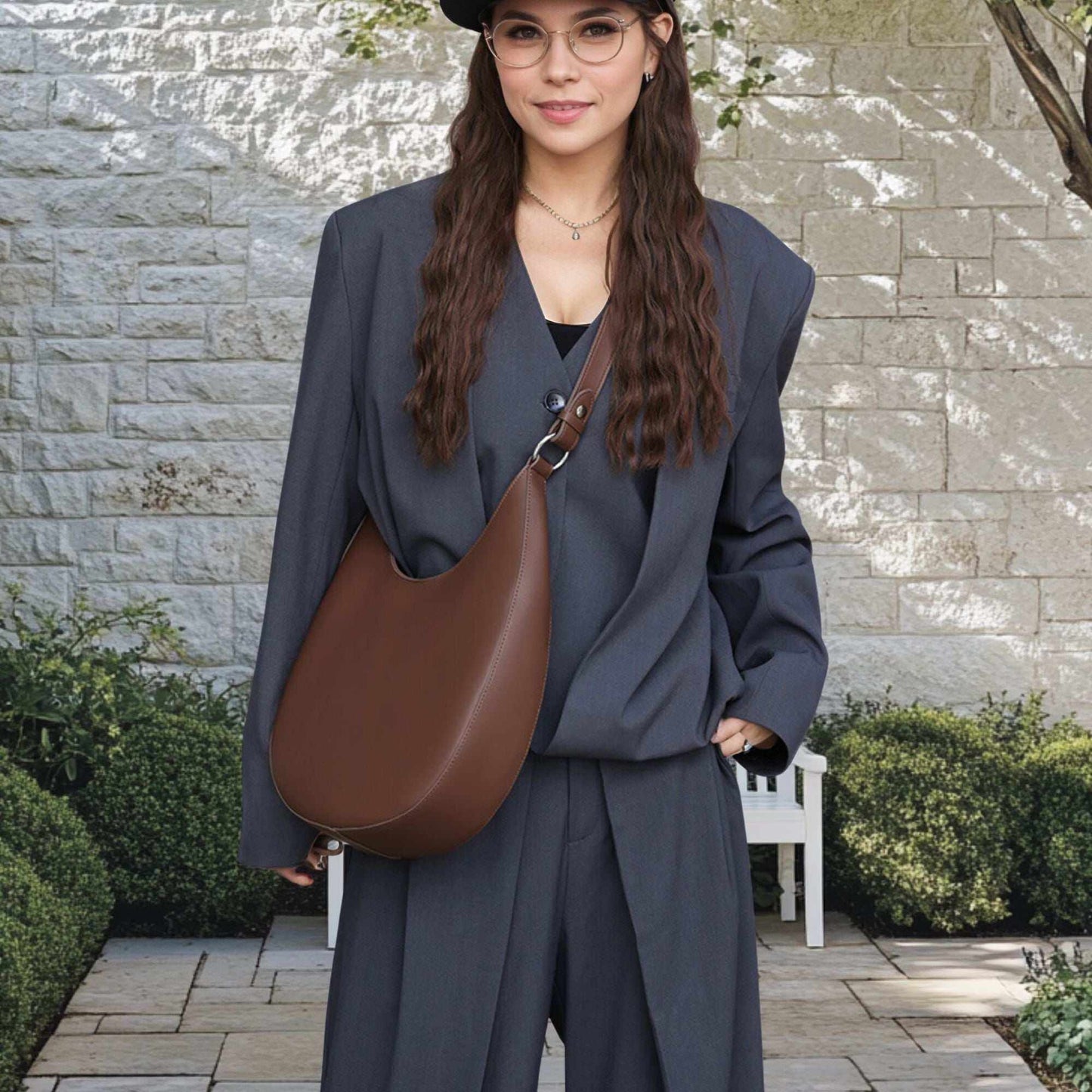 Woman wearing a brown Crossbody Saddle Purse with a chic suit outdoors.