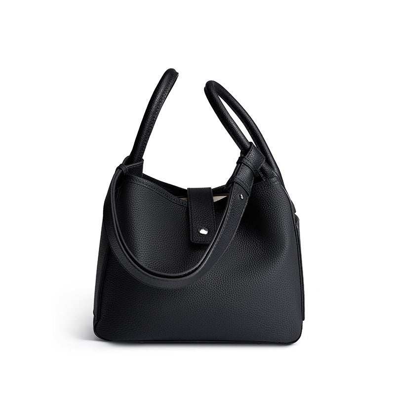 Dual handle lychee leather handbag in basket-shaped silhouette