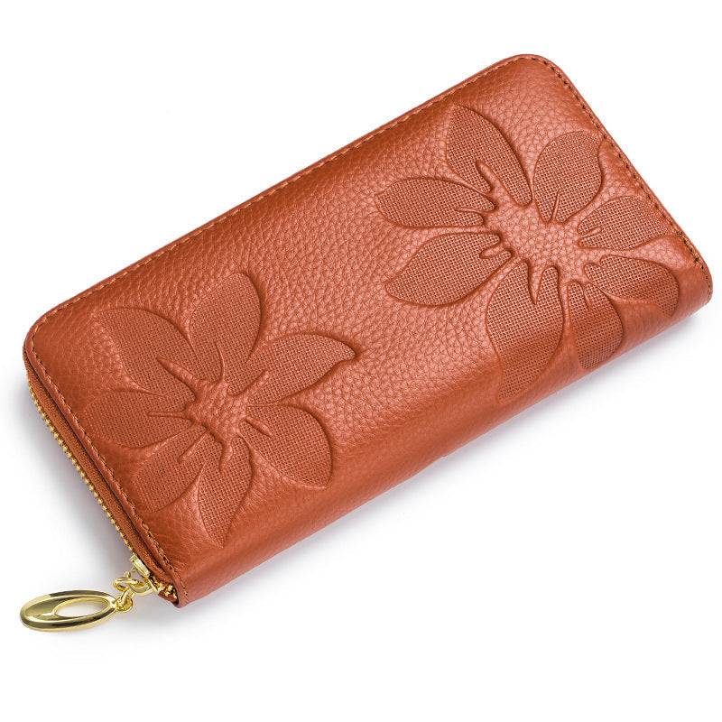 Ladies leather floral wallet with embossed flower design, compact, genuine leather, stylish accessory.