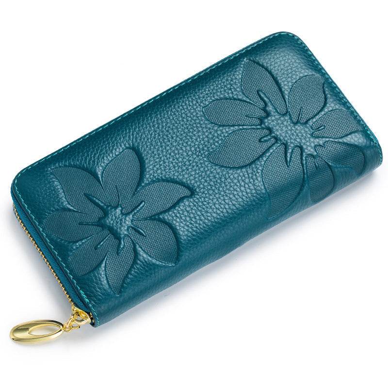 Ladies leather floral wallet in teal with embossed floral design.