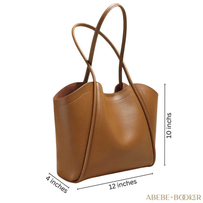 Ladies Leather Tote with rolled leather straps, spacious interior, and magnetic closure, dimensions 12.2x10.2x4 inches.