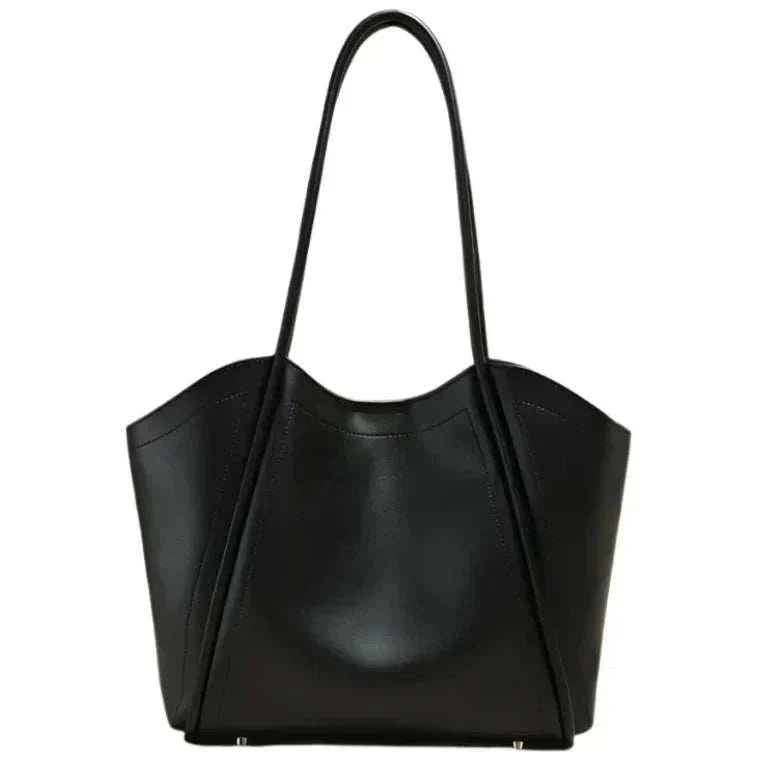 Ladies Leather Tote with sleek design and rolled leather straps.