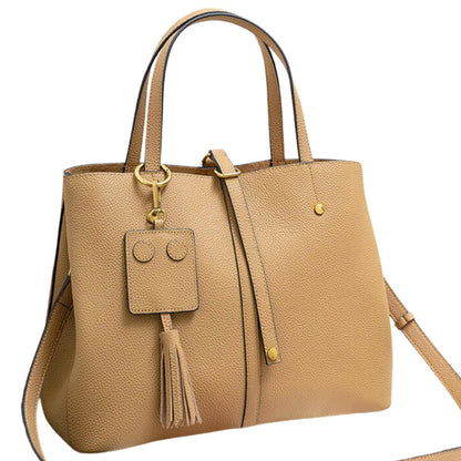 Ladies leather work bag in caramel with tassel and versatile straps.