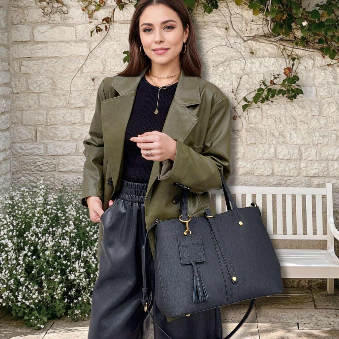 Woman holding Ladies Leather Work Bag in black, stylish and versatile.