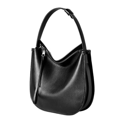 Large crossbody satchel in black genuine leather, sleek and structured design, perfect for versatile style.