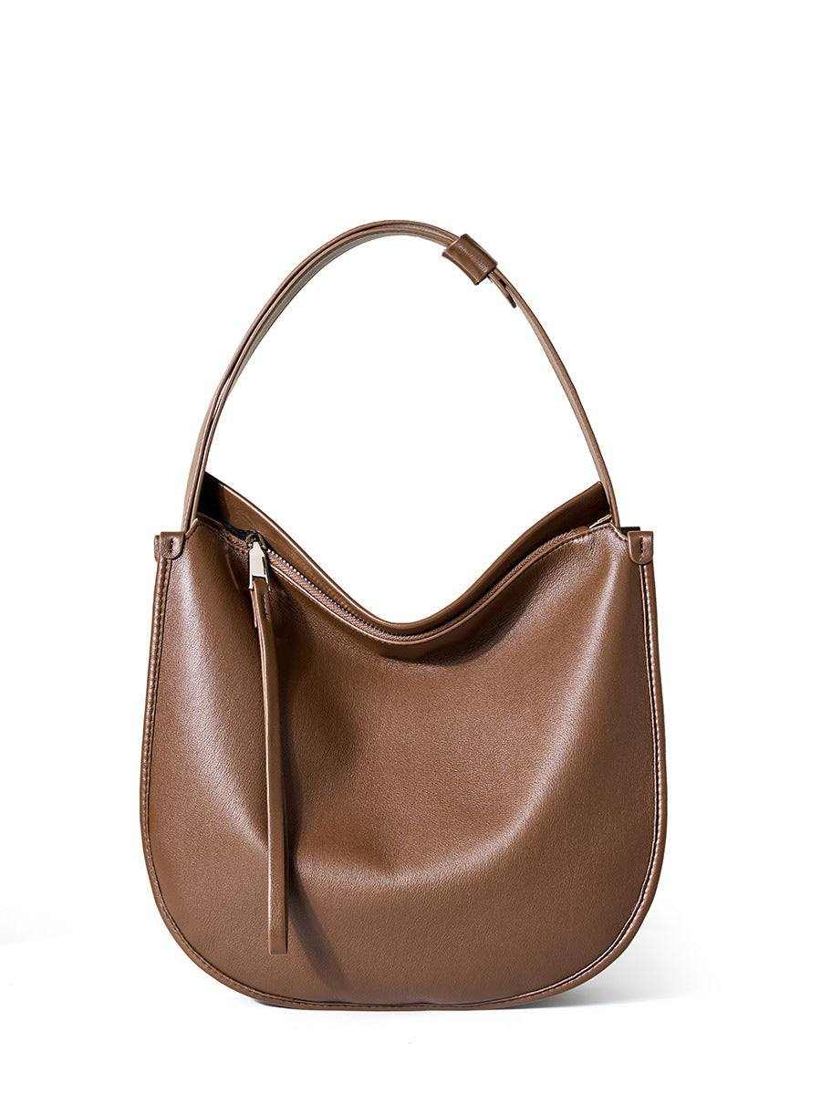 Large brown leather crossbody satchel with handle, sleek design, and pleated exterior.