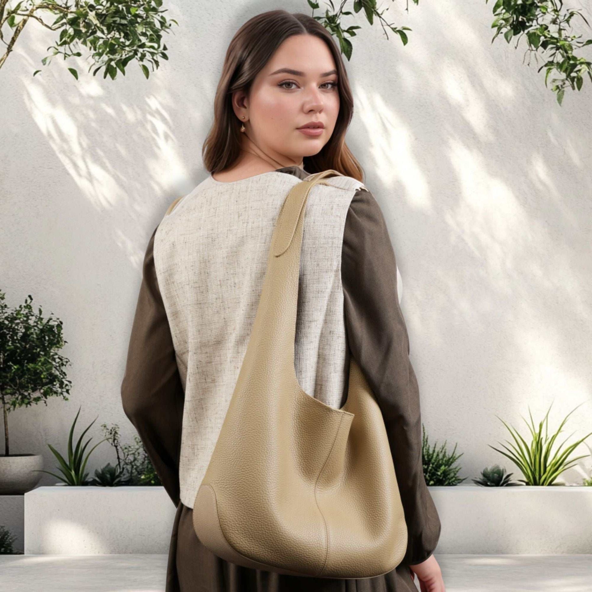 Large Leather Tote Bag in beige, worn by a model, showcasing its elegant and functional design.