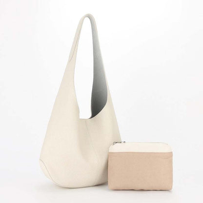 Large leather tote bag with beige pouch, simple design, genuine leather, spacious and stylish.