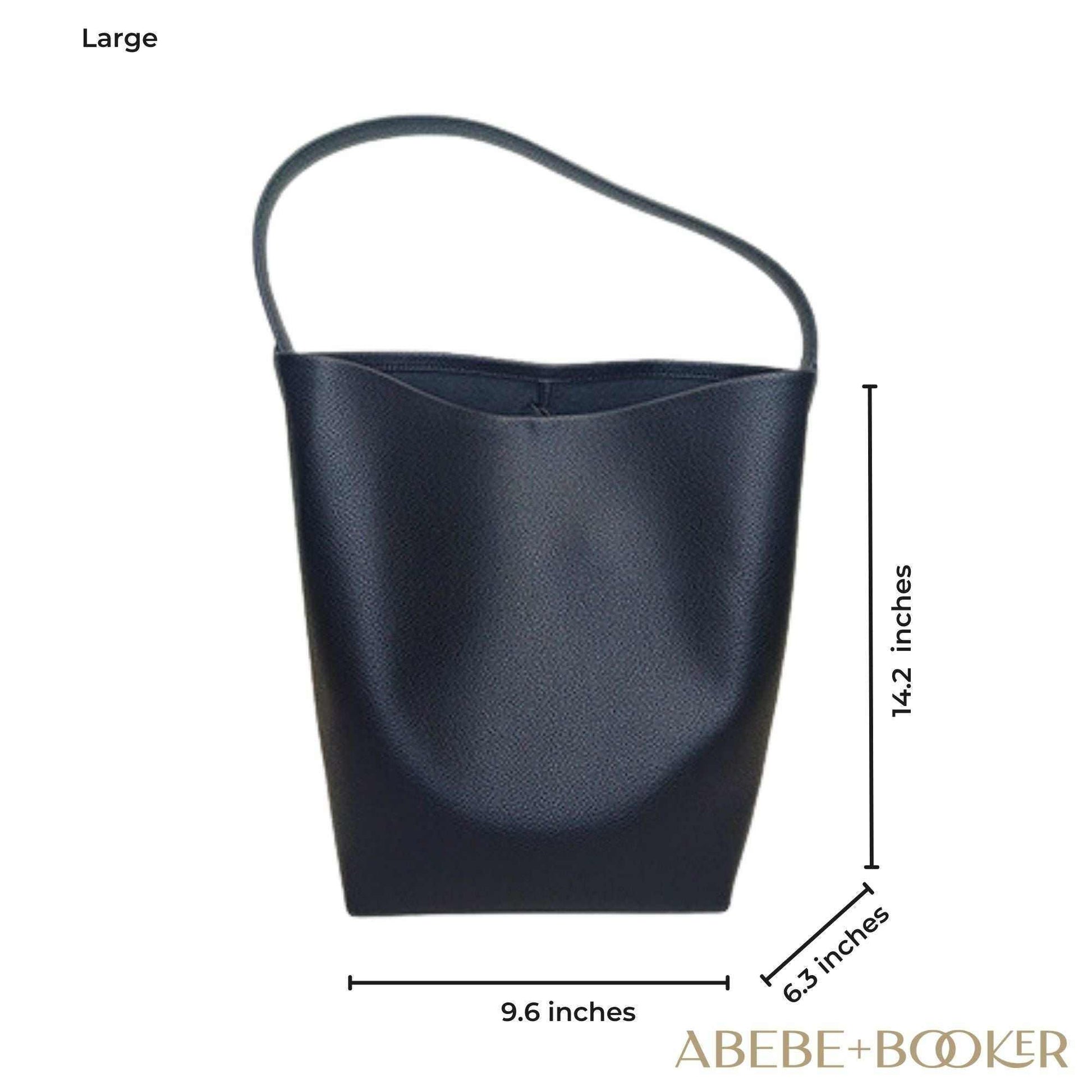 Large black leather bucket bag with dimensions; elegant design from the Essence of Elegance Handbag Collection.