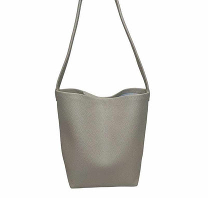 Iconic Leather Bucket Bag Lychee with chic pattern and spacious design.