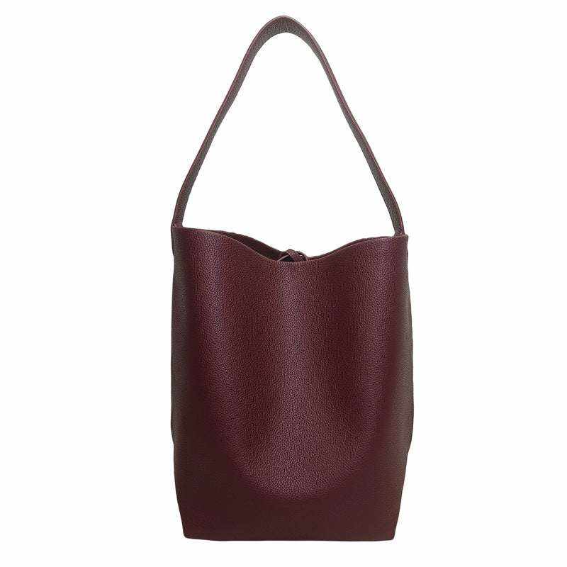 Iconic Leather Bucket Bag Lychee with chic finish and spacious design.