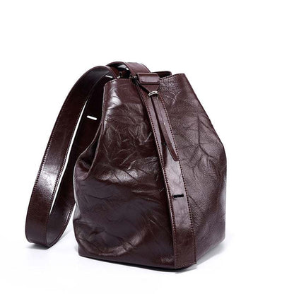 Leather convertible backpack with genuine leather texture, versatile design for style and function.