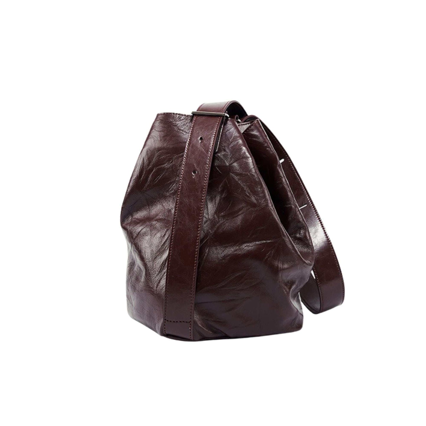 Leather convertible backpack with versatile design, featuring genuine leather and reinforced bottom.