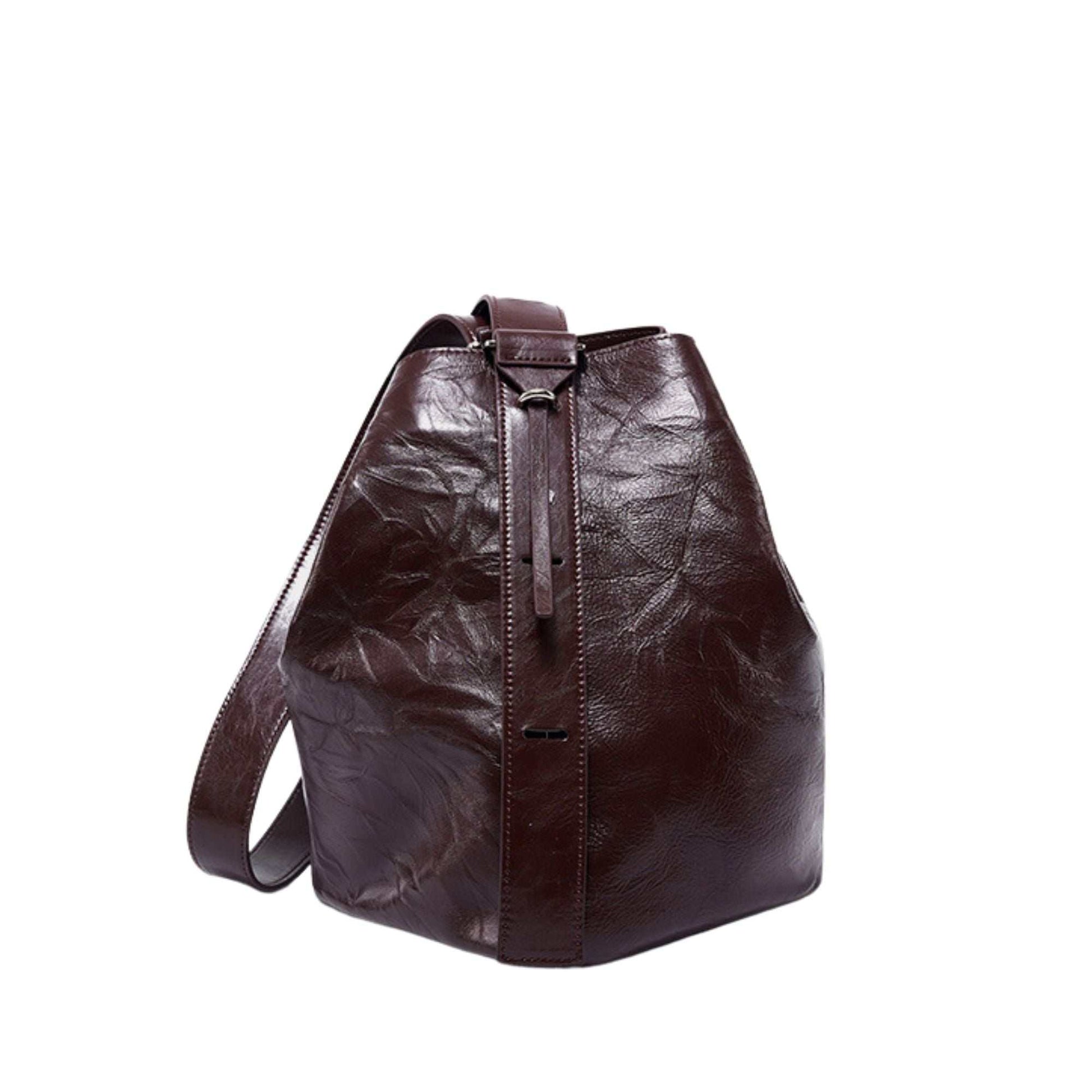 Leather convertible backpack in durable genuine leather with adjustable straps.