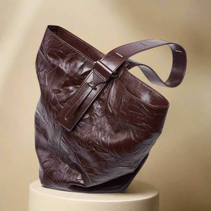 Leather Convertible Backpack with stylish wrinkled leather design on display.