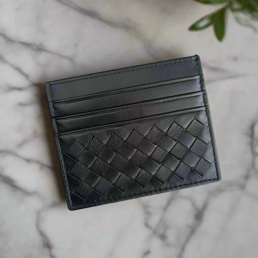 Sleek genuine leather credit card carrier with woven design, compact and lightweight for easy carrying.