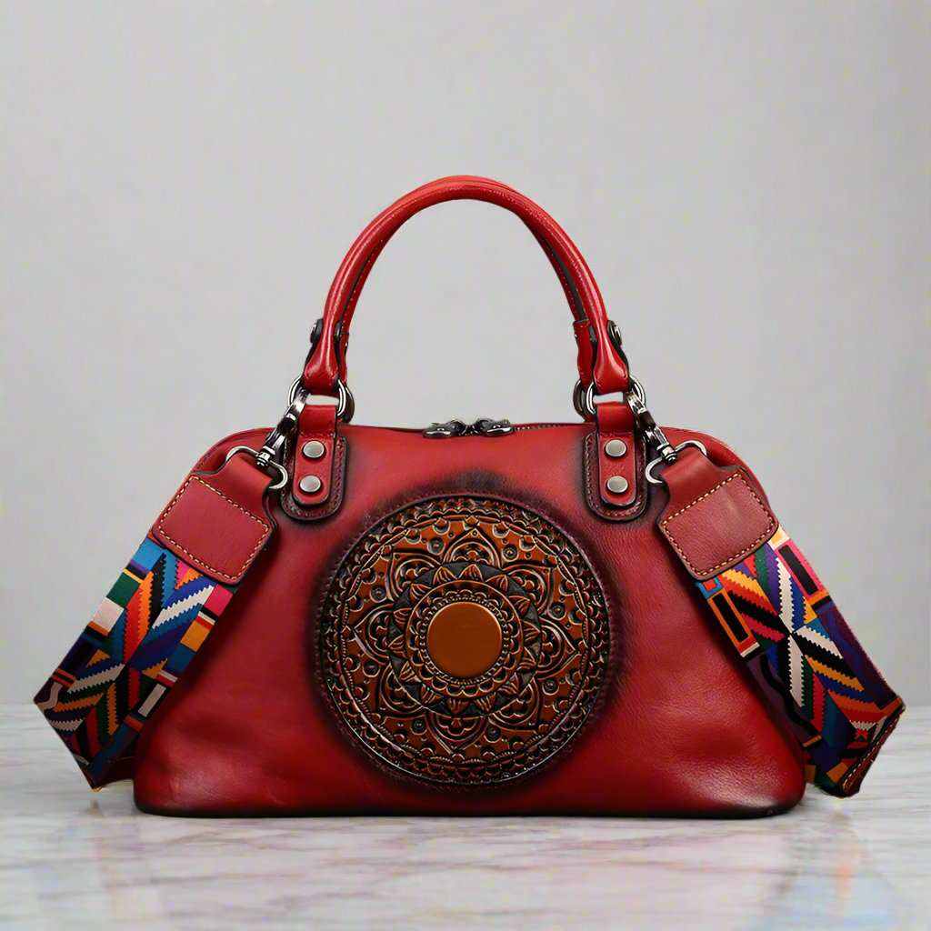 Genuine leather retro bag with vintage embossed medallion design, colorful strap, and sturdy handles.