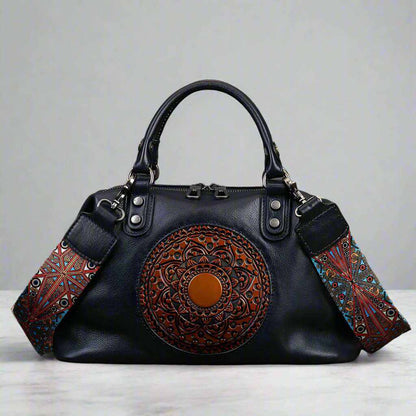 Genuine leather vintage embossed medallion handbag with retro design.