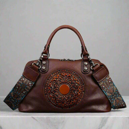 leather retro bag with embossed medallion design and colorful strap