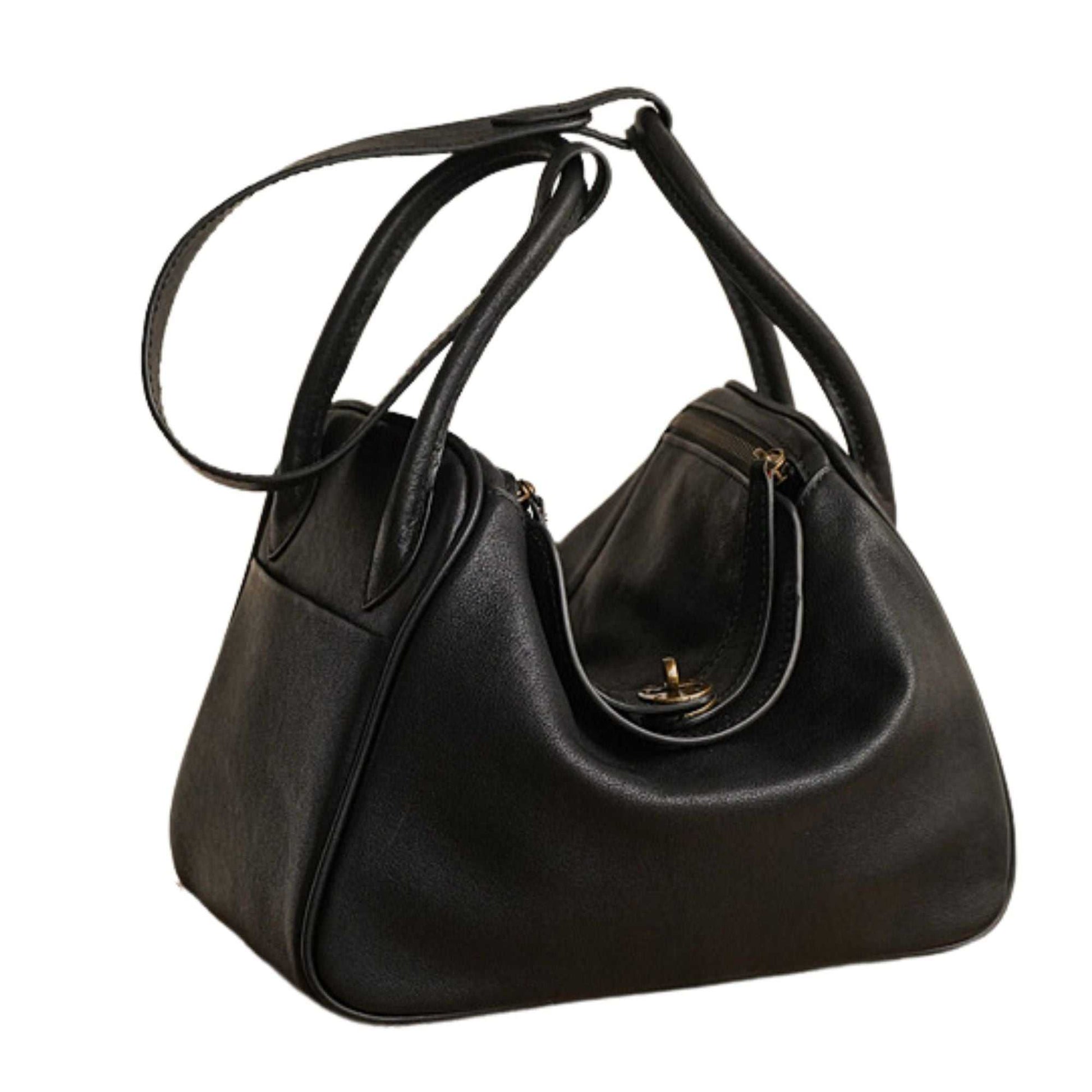 Stylish black leather satchel purse with adjustable straps and secure zipper closure.