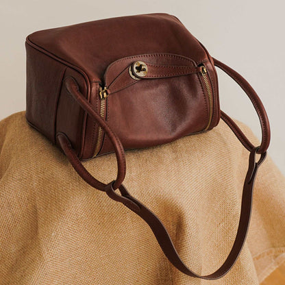 Leather Satchel Purse in rich brown leather with adjustable strap and secure closure.