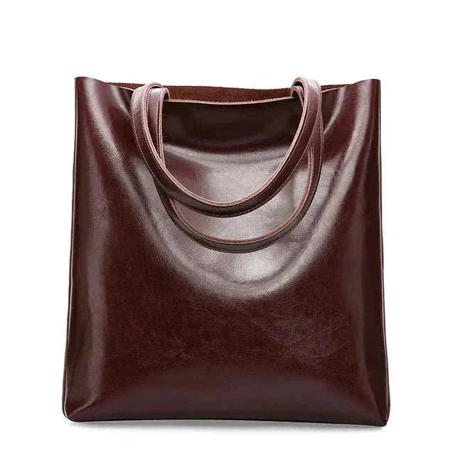 Elegant retro leather shoulder bag with dual handles, rich brown color.