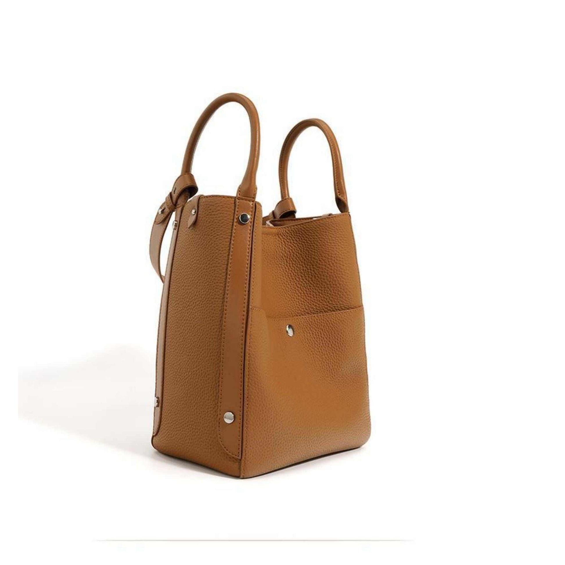 High-quality leather tote bag crossbody in light brown, versatile design with dual handles and adjustable strap.