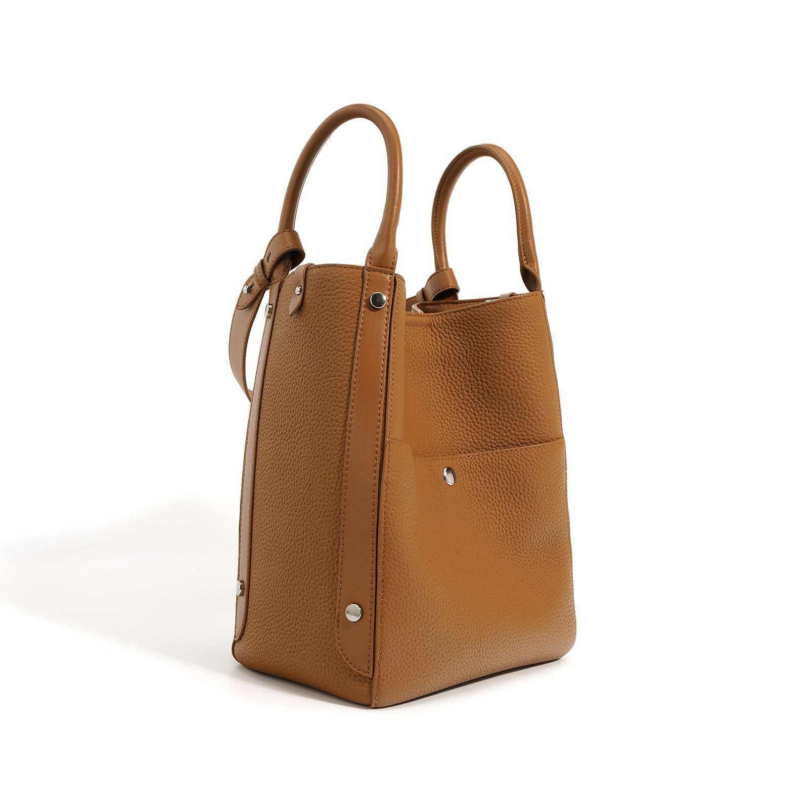 Elegant leather tote bag crossbody in light brown with dual handles and adjustable strap.