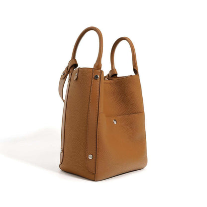 Elegant leather tote bag crossbody in light brown with dual handles and adjustable strap.