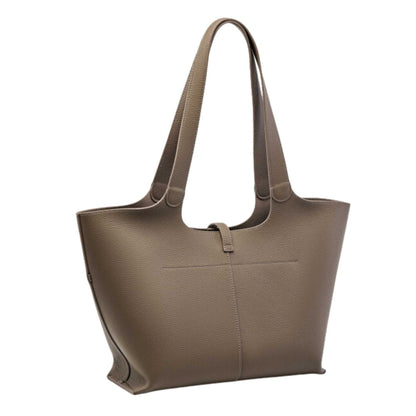 Elegant leather tote purse with zipper and unique concave design for stylish functionality.